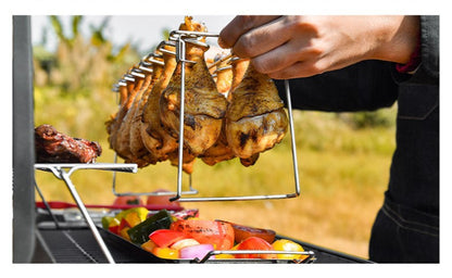 Trailblazer BBQ Rack 14-Slot Stainless Steel Masterpiece being picked up off the grill filled with cooked chicken