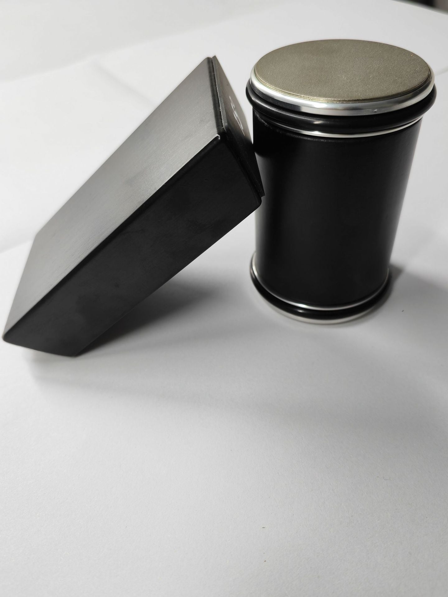 Rolling Knife Sharpener in black with the angle guide resting against the sharpener